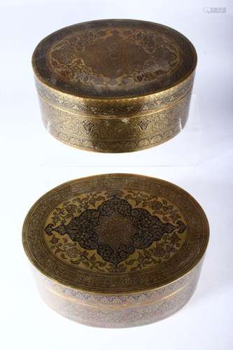 TWO GOOD INDIAN BRASS OVAL BOXES AND COVERS, with profusely engraved and enamelled decoration, 20cm