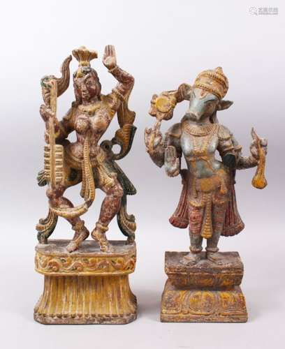 TWO 19TH / 20TH CENTURY INDIAN CARVED WOODEN FIGURES, with poly chrome decoration, 46cm x 43cm