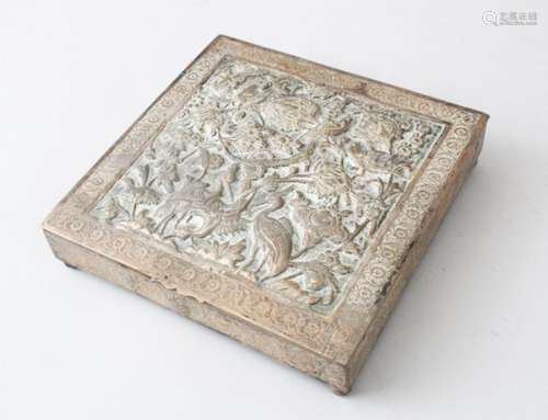 LATE 19TH CENTURY PERSIAN WHITE METAL BOX, the hinged cover embossed with birds and foliage within