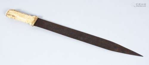 AN ISLAMIC SHORT SWORD WITH BONE HANDLE, the blade etched with calligraphy, 53.5cm long.