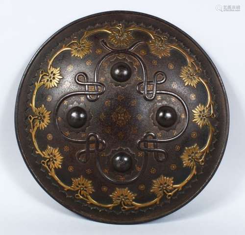 A GOOD PERSIAN CIRCULAR STEEL SHIELD, with gilded decoration and pierced brass onlaid design, 36cm