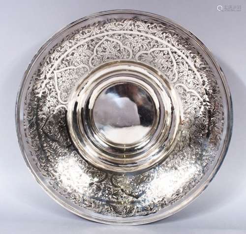 A 19TH CENTURY ISLAMIC SILVER CHASED BOWL, the bowl with floral chased decoration, 35.5cm diameter x