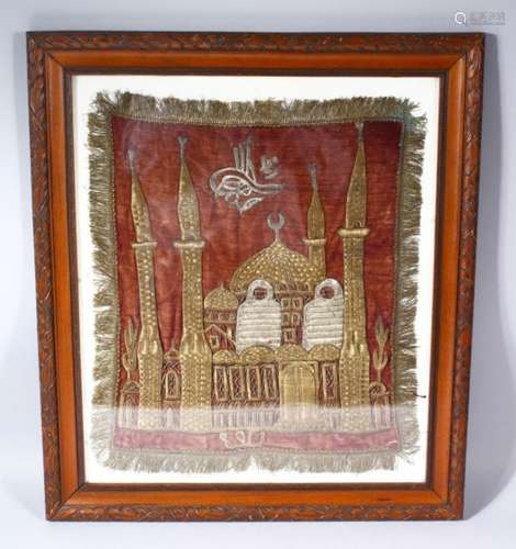 A 19TH CENTURY TURKISH GOLD AND SILVER THREAD EMBROIDERY OF A MOSQUE, on a red velvet ground,