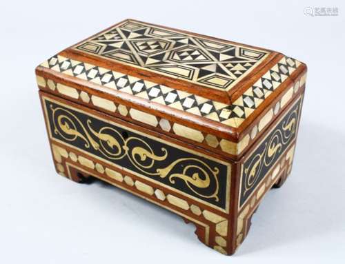 A GOOD ISLAMIC CARVED HARDWOOD AND INLAID SHELL CASKET, the hinged box inlaid with carved mother