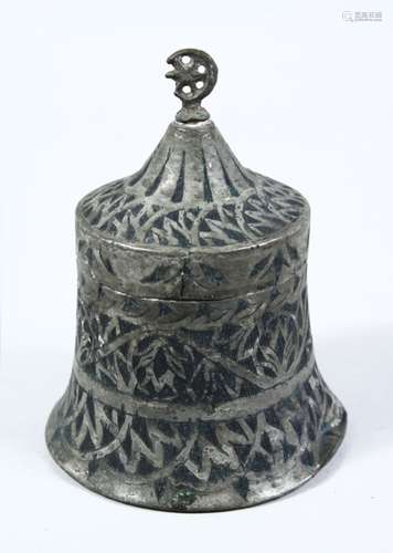 AN EARLY ISLAMIC METAL DISH & COVER IN THE SHAPE OF A BELL, with chased decoration, 16cm high.