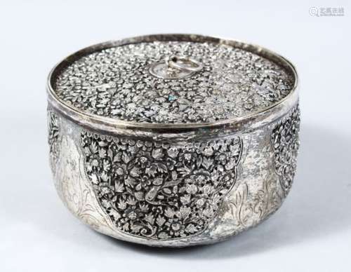 A 19TH CENTURY INDIAN PIERCED WHITE METAL CYLINDRICAL DISH & COVER, with pierced work depicting