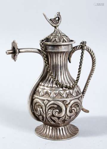 A 19TH CENTURY INDIAN WHITE METAL ROSE WATER DROPPER, 14cm high x 11cm wide.