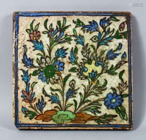 A 17TH / 18TH CENTURY ISLAMIC / IZNIK POTTERY TILE, decorated with floral style, 24cm square.