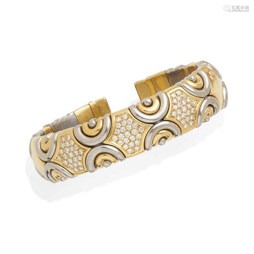 An 18k bi-color gold and diamond bangle, Fred