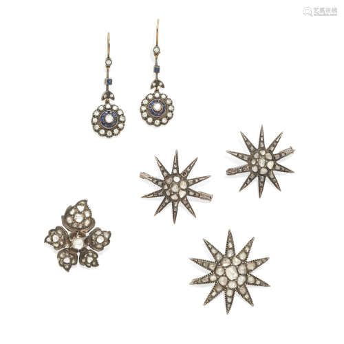 Three antique diamond star brooches, a flower brooch, and a pair of diamond and sapphire ear pendants