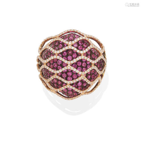 an 18k gold and pink sapphire ring