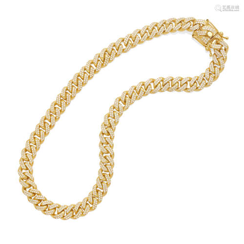 a gold and diamond curb link necklace