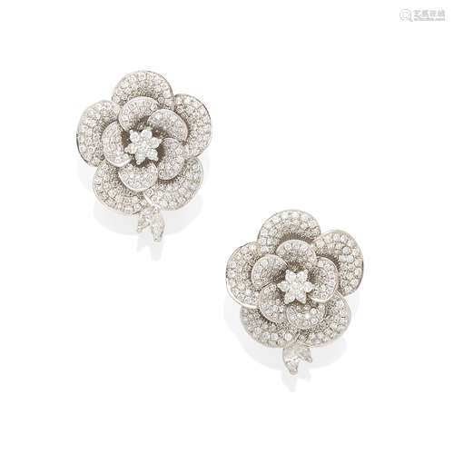 a pair of white gold and pavé Diamond flower earrings