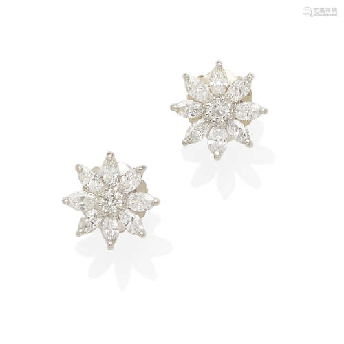 a pair of platinum and diamond flower earrings