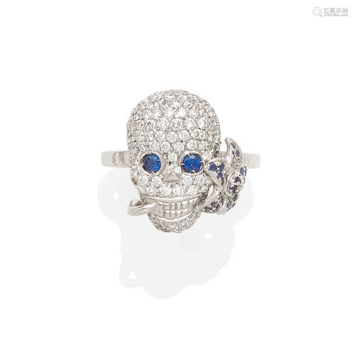 a diamond and sapphire skull ring, Gucci