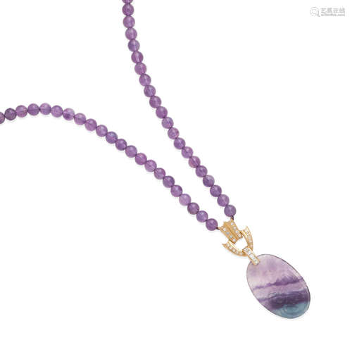 an amethyst bead necklace with fluorite and diamond pendant