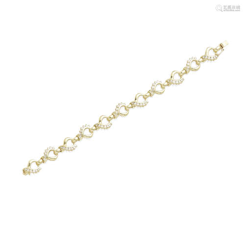 A diamond and gold open link bracelet