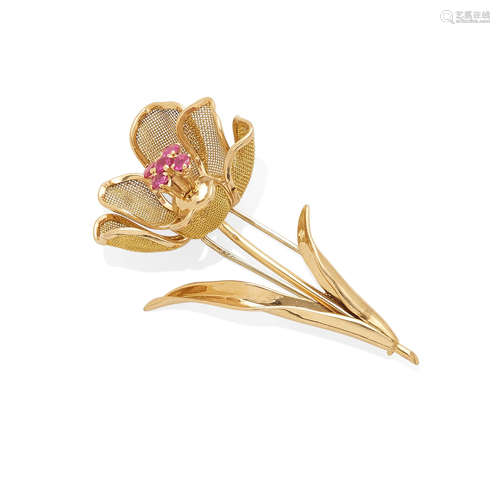 a gold and ruby articulated flower brooch