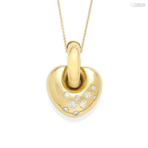 A diamond and gold puffed heart pendant