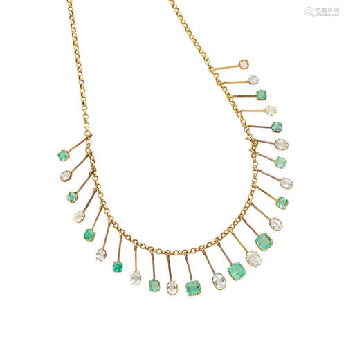 A gold, emerald and aquamarine fringe necklace