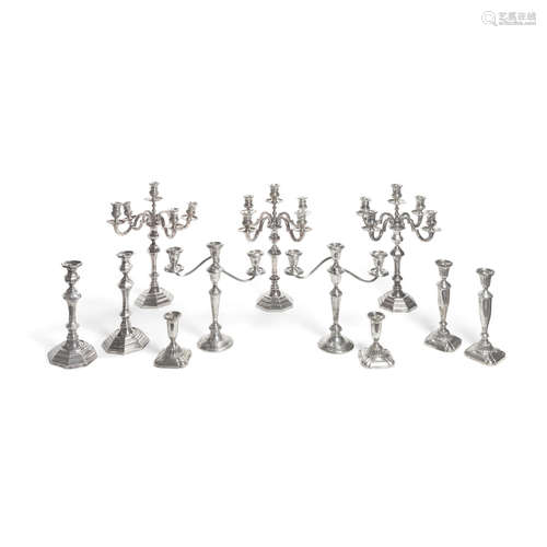 An assembled group of American and Italian weighted sterling silver candlesticks and candelabras,  by various makers, 20th century