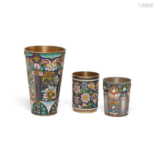 Three Russian gilt silver and enamel cups  by various makers, 19th-20th century