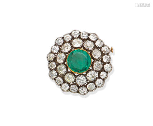 An emerald and diamond brooch