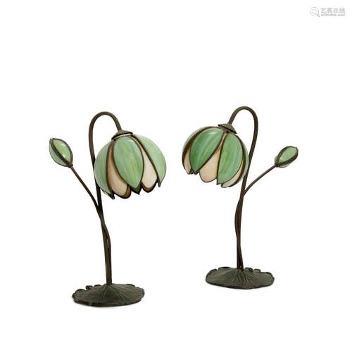 A Pair of Handel Leaded Glass and Patinated Bronze Lily-Form Table Lamps  First quarter 20th centuryEach stamped '1198' on the underside of the base.height 16 1/2in (41.9cm); width 7in (17.7cm); depth 12 3/4in (32.3cm)