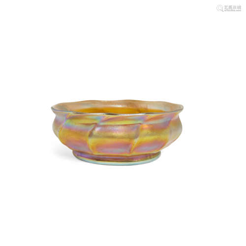 A Tiffany Studios Favrile Glass Bowl  First quarter 20th century Signed 1216 L.C.T. Favrile.height 2 1/2in (6.3cm); diameter 6 3/4in (17.1cm)