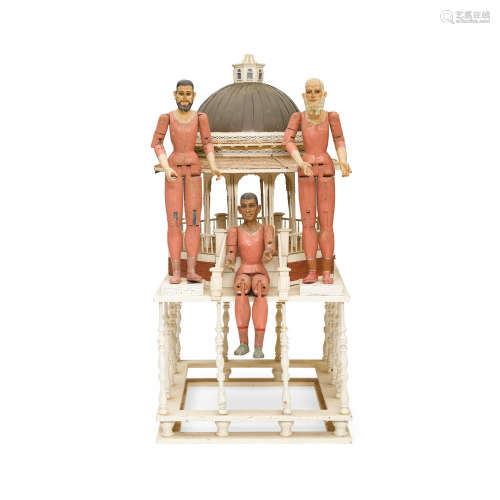 A Group of Three Polychromed Carved Wood Figures of the Three Kings arranged on a Painted Wood Gazebo Probably Central American, 19th century