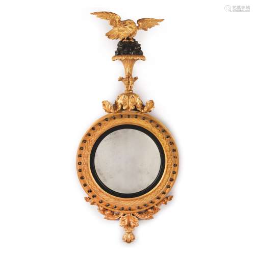 A REGENCY EBONISED AND GILTWOOD CONVEX MIRROR, EARLY 19TH CENTURY