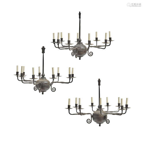 A Set of Three Medieval Style Iron Eight Light Chandeliers  20th/21st century