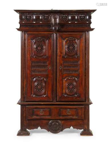 A Brittany Style Carved Walnut Armoire