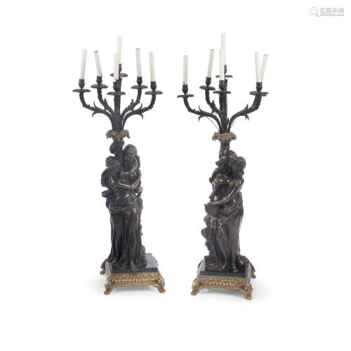 A Pair of Neoclassical Style Patinated Bronze Figural Six Light Candelabra   After Claude Michel Clodion