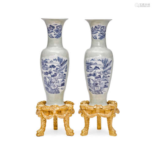 A pair of massive celadon glazed porcelain vases with underglaze blue landscape reserves