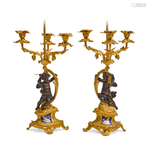 A Pair of Napoleon III Gilt And Patinated Bronze and Porcelain Figural Three Light Candelabra   19th century