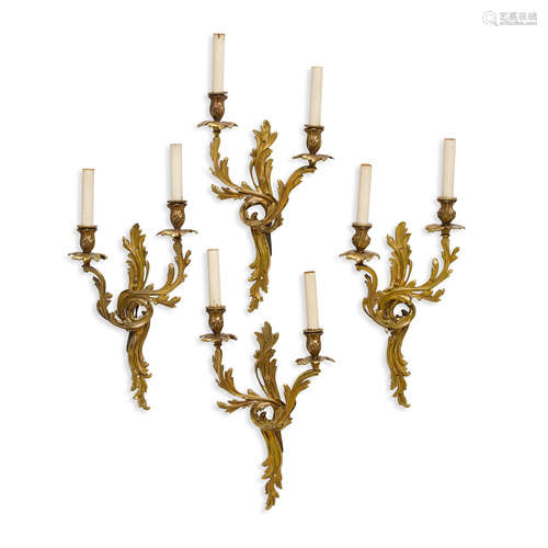 A SET OF FOUR LOUIS XV STYLE bronze Two light Sconces