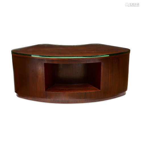 A Mahogany and Glass Desk  Attributed to Gilbert Rohde, circa 1940height 25 1/4in (64.1cm); width 62in (257.4cm); depth 26in (66cm)