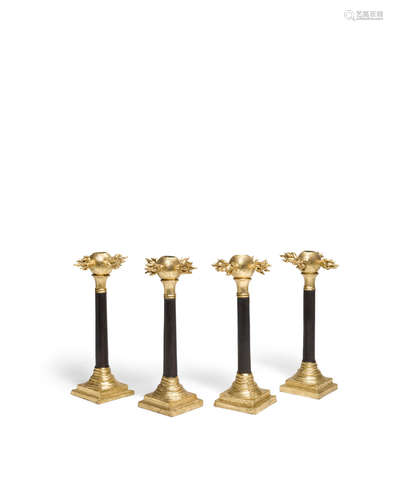 A Set of Four Oriel Harwood Painted and Gilt Decorated Ceramic Candlesticks  1990sFor David Gill, stamped on underside H David Gill London.height of each 12 3/4in (32.4cm)