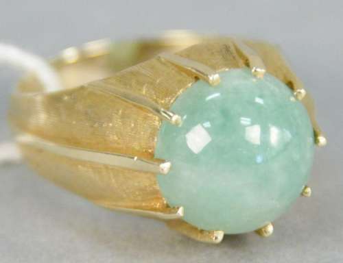 14K gold ring with round cabochon cut jadeite, stone