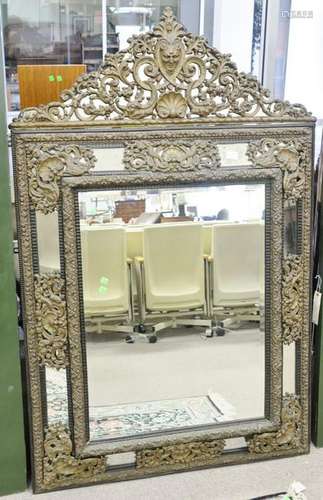 Baroque style mirror, with embossed brass. ht. 63 in.,