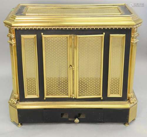 Brass and metal stove, with grill work brass doors,