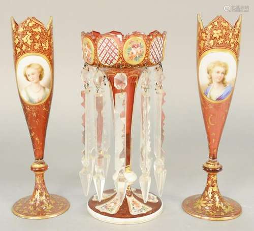 Three Victorian cranberry vases, to include a pair of