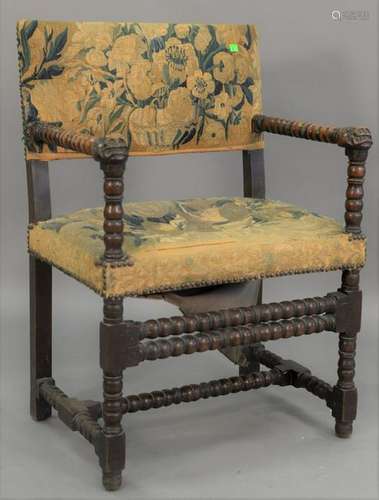 Jacobean armchair, with carved face hand rests and