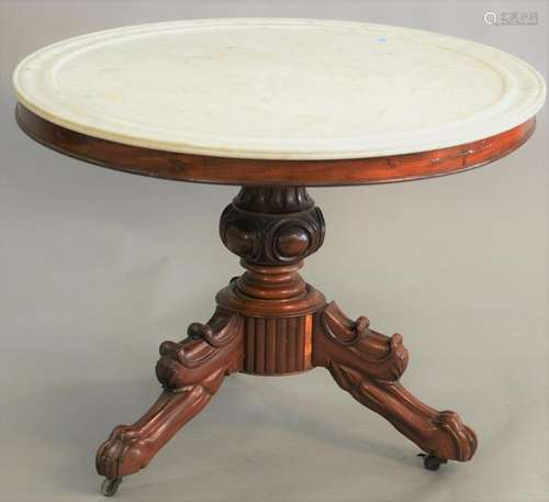 Victorian mahogany round center table having white