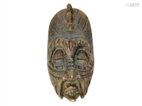 A 20TH CENTURY AFRICAN WALL MASK