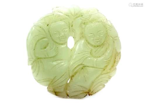 CHINESE JADE CARVING, modelled with two figures in a circular shape, 5.5cm diameter