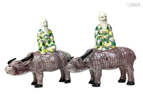 A LOT OF TWO EARLY 20TH CENTURY CHINESE MODELS OF BUFFALO AND RIDER