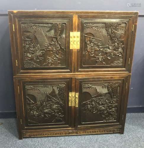 A 20TH CENTURY CHINESE CARVED WOOD FOUR DOOR CABINET