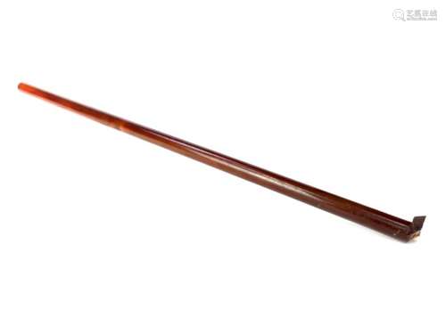 AN EARLY 20TH CENTURY BAKELITE CYLINDRICAL STICK